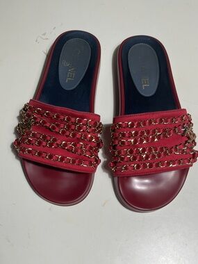 CHANEL Red Slide Sandals with Gold Chain Detail